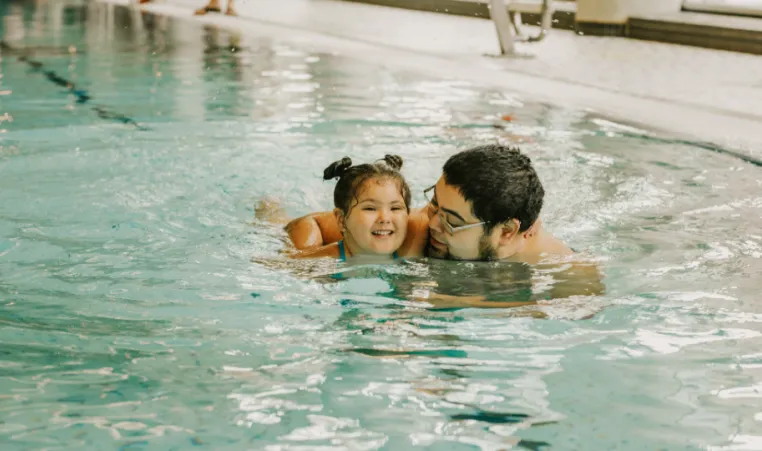 dad and daughter in pool