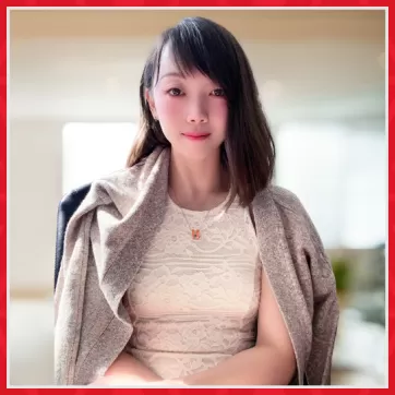 Young women with slight smile in office chair