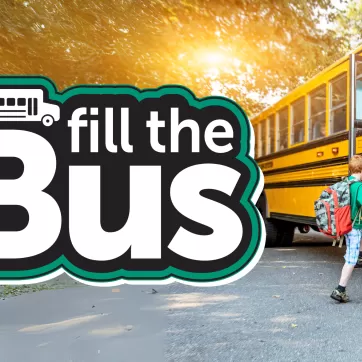 Fill The Bus logo with child getting on bus 