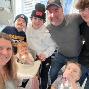 Marthas family smiling at camera
