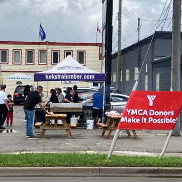 A charity barbeque takes place outside of a lumber store in Hamilton