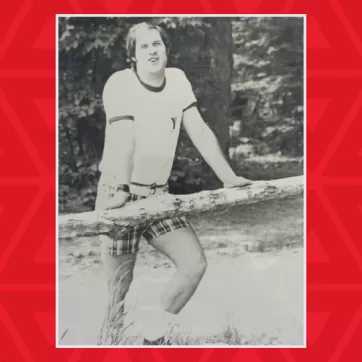 black and white photo of a young Wayne Perkins at camp