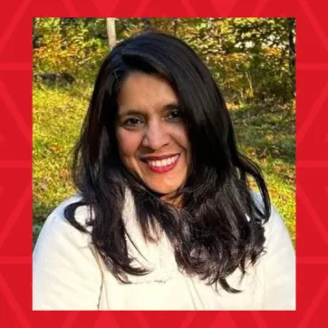 woman in white sweater smiling