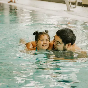 dad and daughter in pool