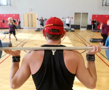 Staff instructing strength training class