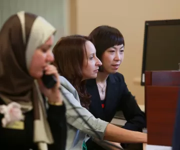 Female Employment Coach on the phone at desk