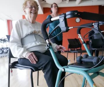 Senior female member participating in chair exercises