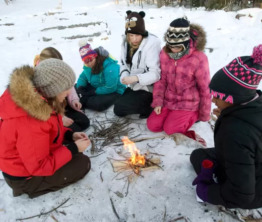 Group of youth girls building fire