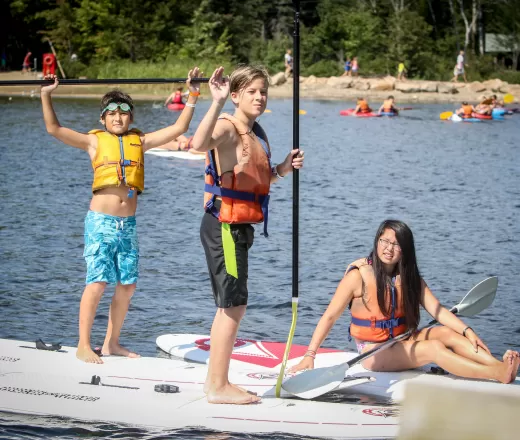 Wanakita campers on paddle boards