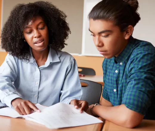 educator and youth studying together