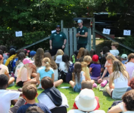 Group of kids sitting in front of counselors