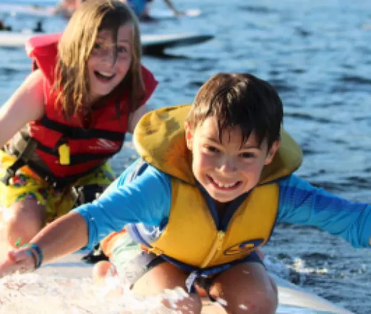 Kids smiling in the water