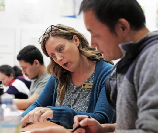 Y To Work employee helping a client