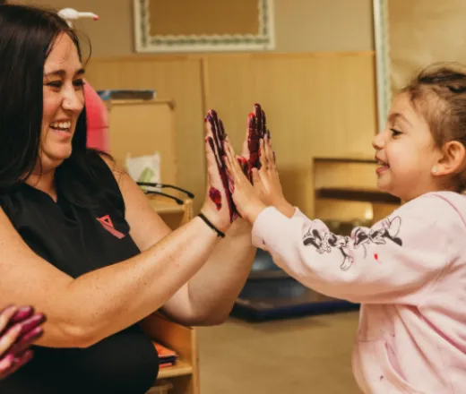 YMCAHBB Staff member with child