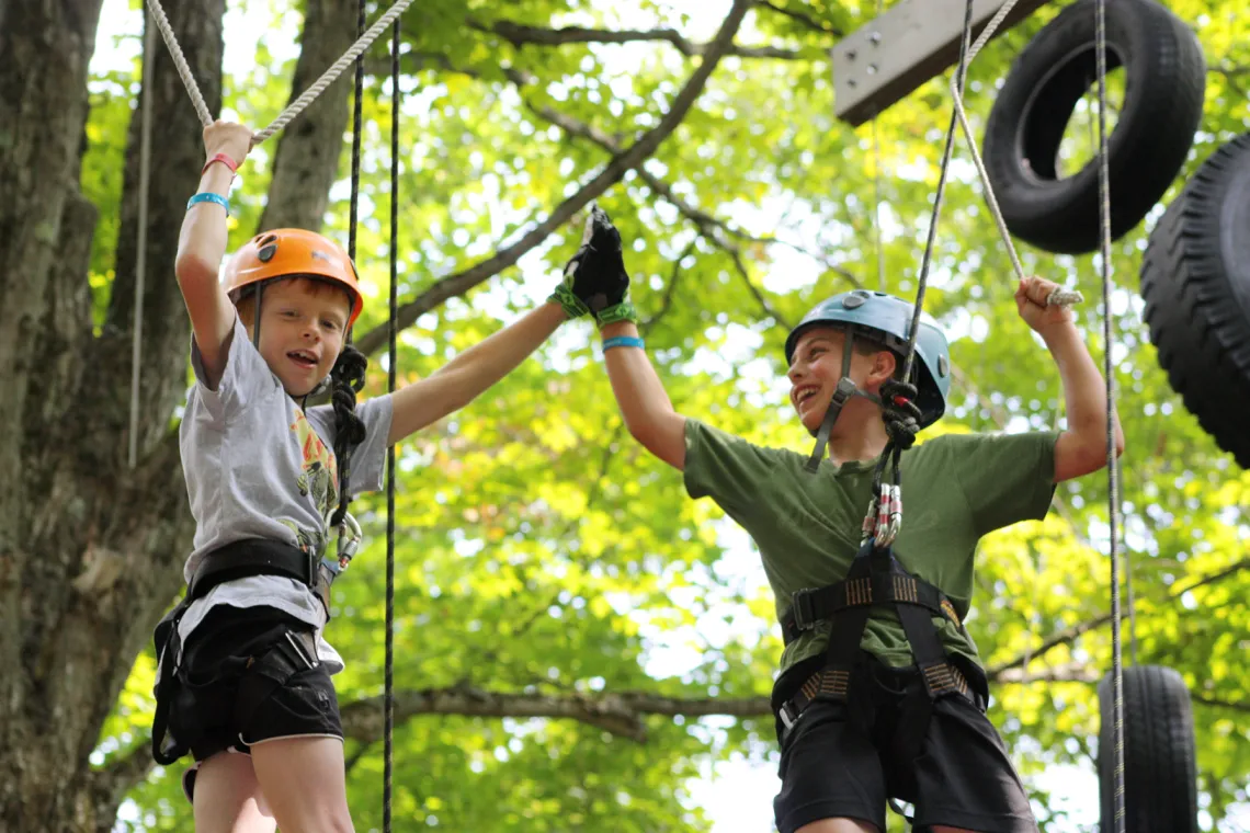 Father and son on high ropes