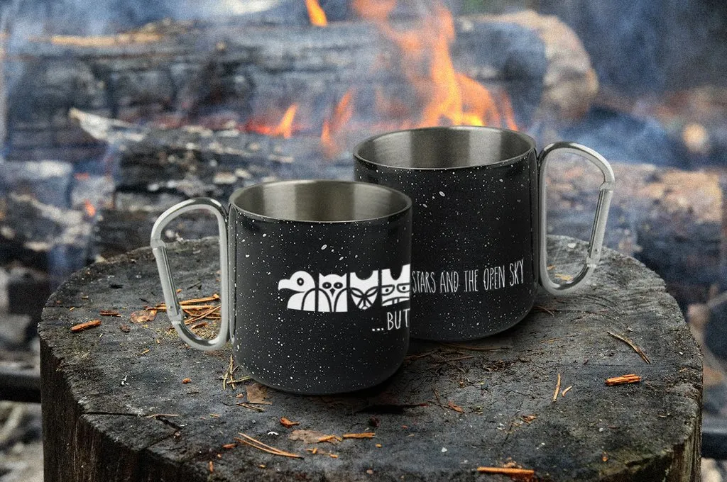 Wanakita mugs sitting by campfire