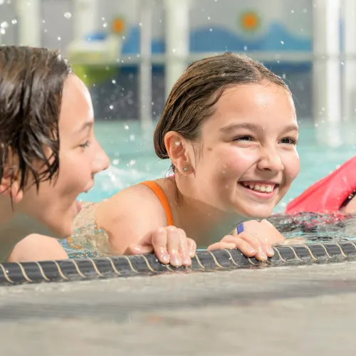 Girls swimming and smiling