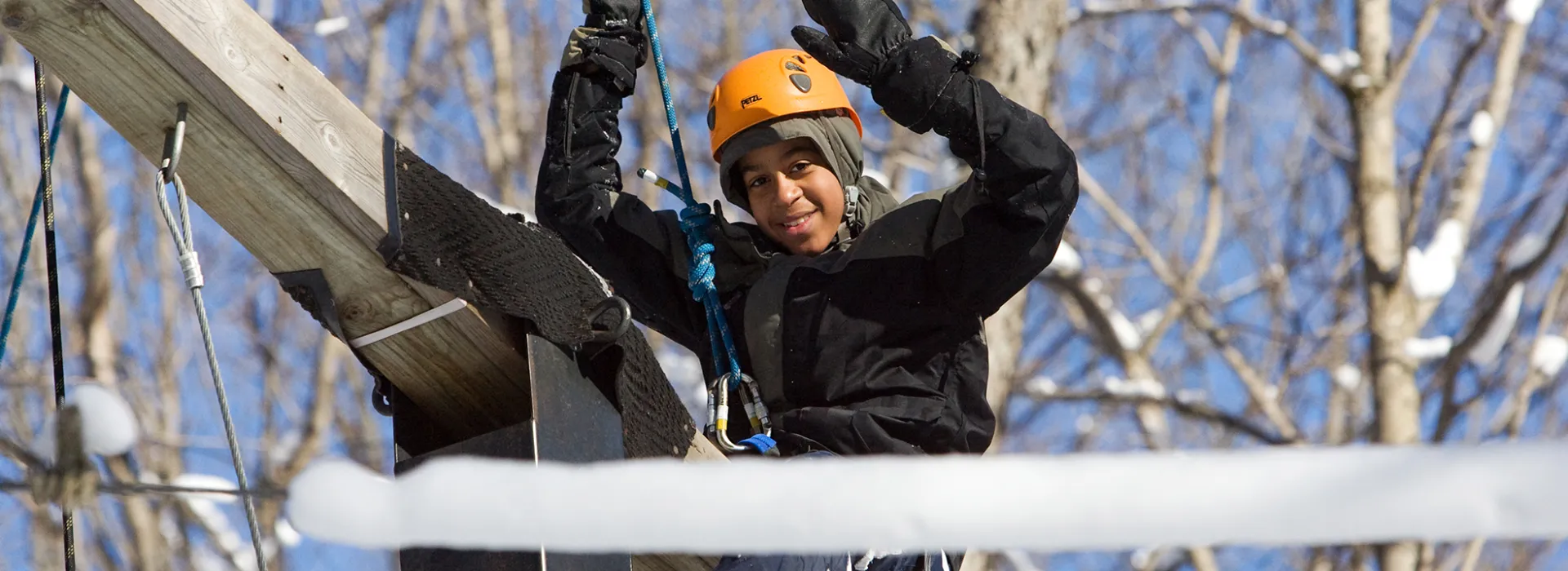 Youth boy on high ropes