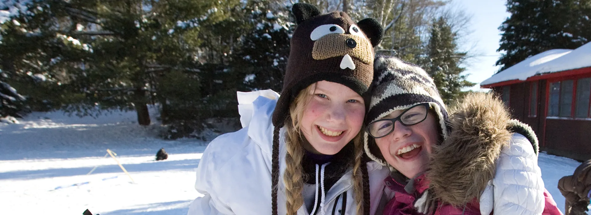 Two youth girls hugging