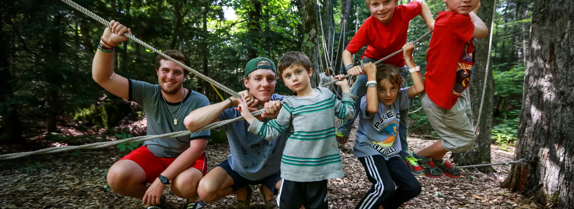 Wanakita male campers participating in low ropes