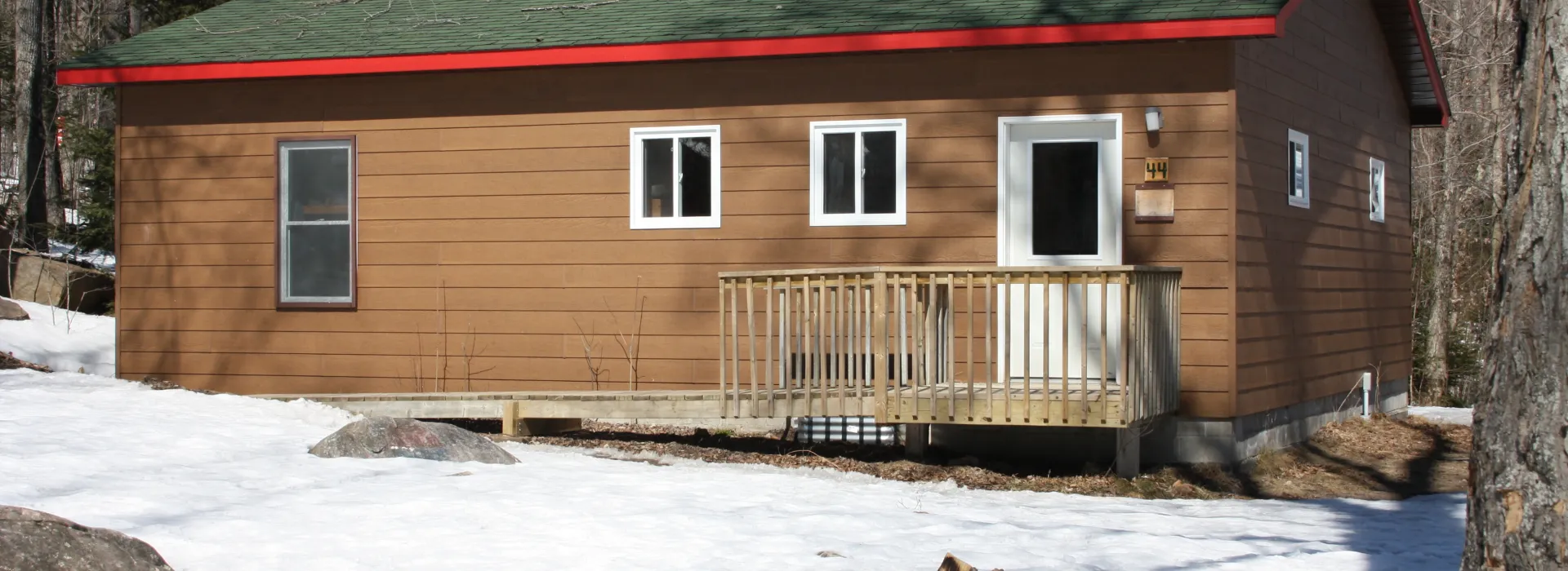 Exterior of winterized cabin with fire pit