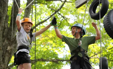 Father and son on high ropes