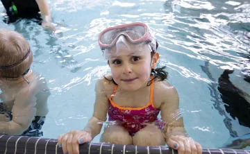 Female child participating in swim lessons