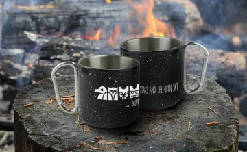 Wanakita mugs sitting by campfire