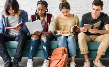 Youth looking at books studying