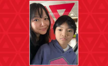 mother and son in front of YMCA sign