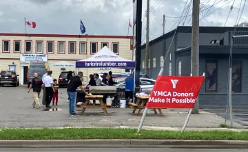 A charity barbeque takes place outside of a lumber store in Hamilton