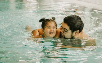 father daughter swimming pool