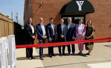 Individuals at ribbon cutting event