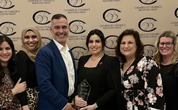 Group of people with glass award