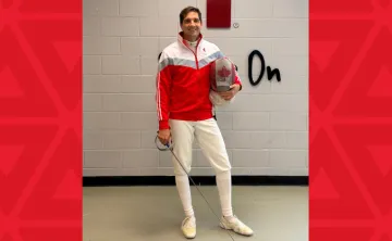 Man in late 40s in fencing gear